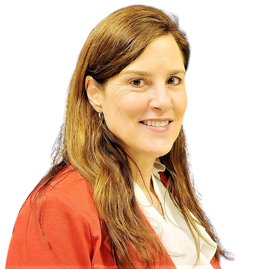 A woman with long brown hair, wearing a red blazer over a white blouse, smiles at the camera against a plain light background.